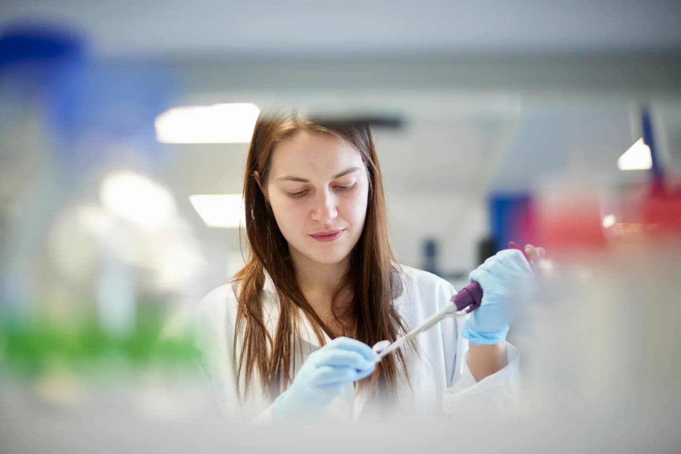 Lab scientist working with a pipette